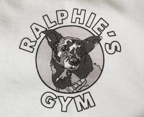 Ralphie, is the small senior gym dog that is here to greet you.