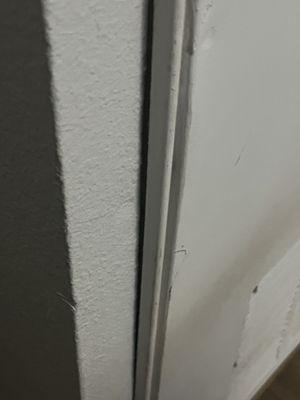 Look like it was forced screwed in the walls