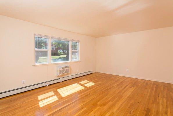 Spacious rooms with hardwood floors are classic and easy to clean.