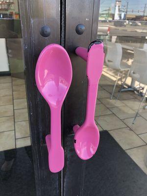 The entrance has cute creative pink handles like the signature ice cream spoons they serve.