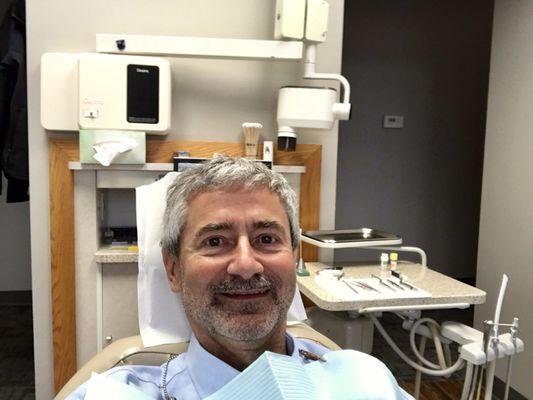 Who smiles at a dental office before treatment‽