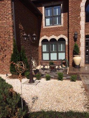 Complete landscaping, lighting, pea gravel, patio, fire pit