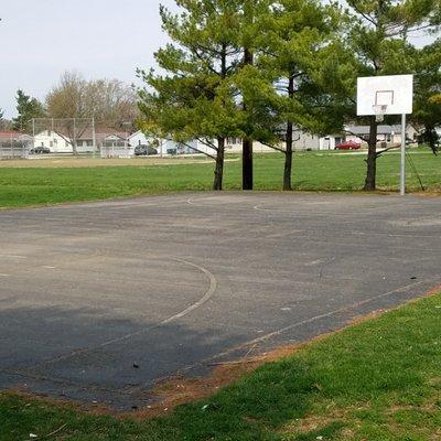 basketball court and baseball diamond in the back