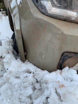 Bumper resting on the road without any tire resistance.