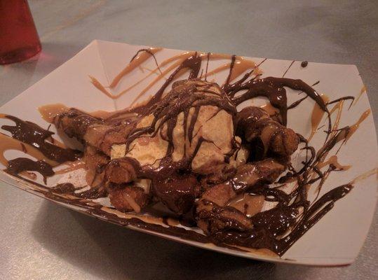 Churro sundae with dulce de leche, chocolate sauce, and ice cream