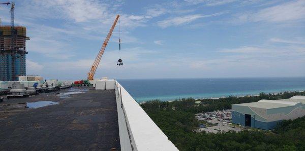 Loading a commercial roof that will be getting a 25 year warranty.