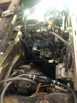 Bobcat repairing a flooded engine