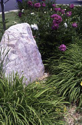 Rock outside of St. Paul's reads Psalm 96:12.