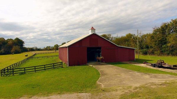 Gated estate home with 48.9+/- acres, shared lake and barn.