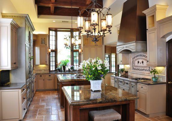 This kitchen has two islands and two pantries one is even a walk through.