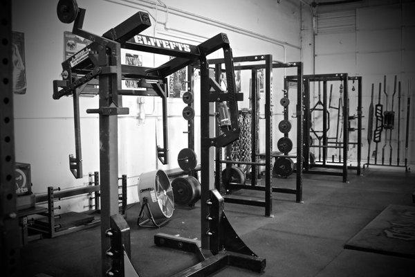 Several squat racks, combo racks, and a mono lift.