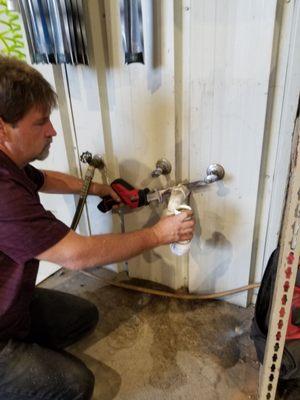 Put in air conditioning now plumbing in the ac drain line to the the mop sink drain. (Brad owner helping hands services)