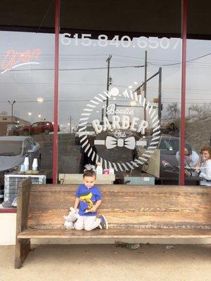 He was so happy to get that lollipop! Out in front of the shop.