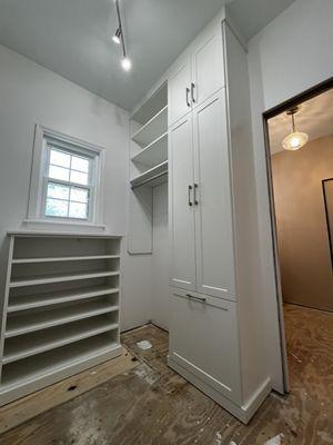 Linen closet, hamper, storage & long hanging area.