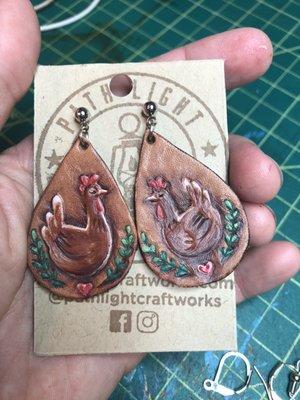 Hand carved and painted custom veg tan earrings