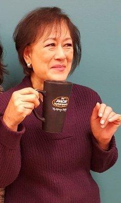 Our HR expert with her favorite PACE coffee mug.