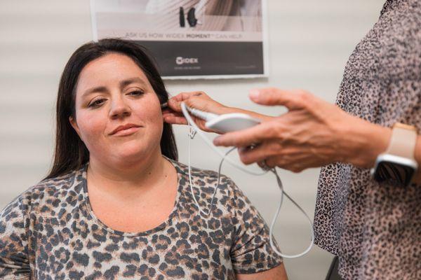 A patient having a test done for hearing.