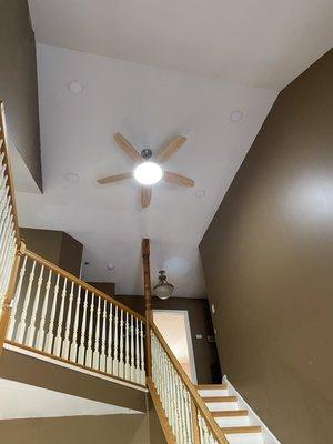 Ceiling fan , and recessed lights installed in foyer