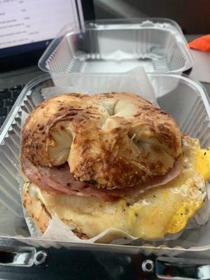 Kielbasa egg and cheese on an asiago bagel