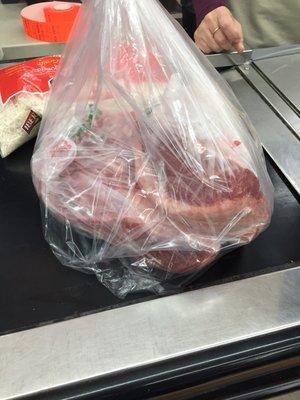 The cashier was just as bewildered as me seeing the meat packaged like this.