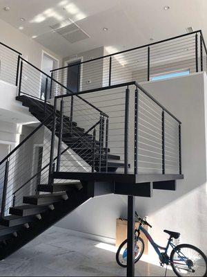 steel stairs with cable railing also wood treads