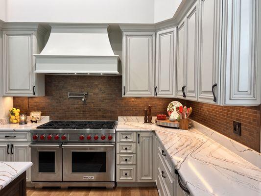 Brick look tile backsplash in the Transitional Style Kitchen for Baytowne Ave. Home at Sandestin, FL