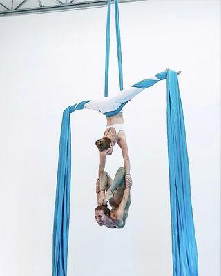 Owners Dara Minkin and Claudia Torkelson performing a duet on aerial silks.