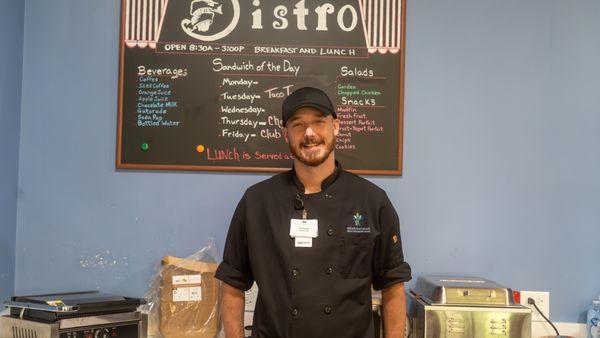 Travis, our head chef, carefully crafting exceptional meals for our residents.