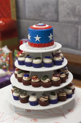 Captain America cake topper and cupcakes with Avenger rings on top