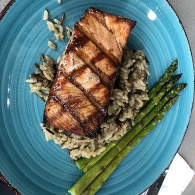 Grilled salmon over wild rice and asparagus