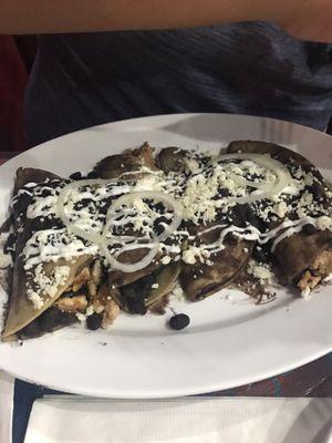 Stuffed tortillas, black beans cheese rice.  Real good