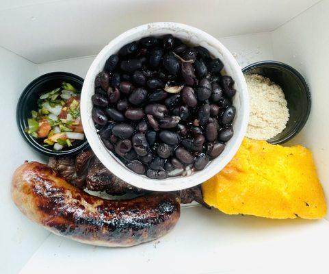 Happy box: picanha steak skewer, sausage with pico de gallo, rice and beans, farofa and cornbread