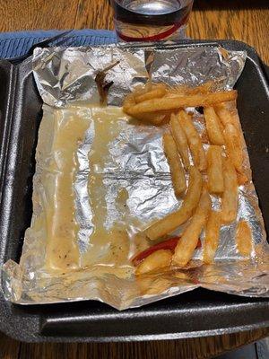 The pic shows the watery cheese substance and some fries.