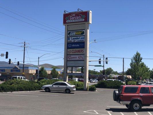 Tuesday, June 18, 2019: newly-added Queen Spa sign on main plaza sign.