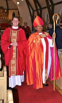 Bishop Gayle Harris walks with the new rector of St. John's, The Rev. Bret Hays.