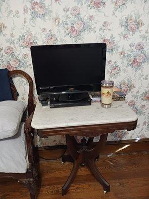 "My first Sony", TV and DVD player, tiny room,water-rott pealing wallpaper