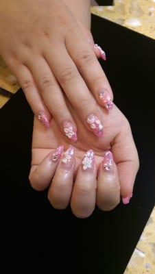 Gel tips with glitter ombre,  gems and sculpted flowers.