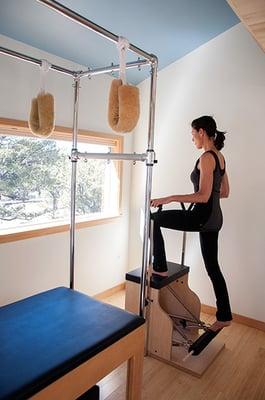 A client on the Pilates chair. Great form!