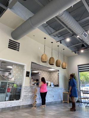 Ordering window with view of super clean kitchen and fresh homemade tortillas!