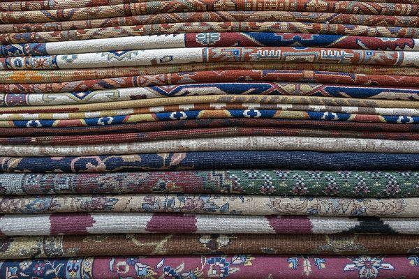 Antique Oriental Rugs Center (AORC) Oriental rugs stacked