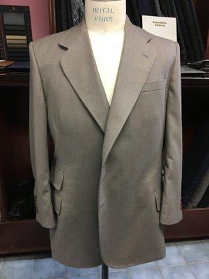 A taupe sport coat with the tailor's signature cloverleaf lapels made by John Di Pietro.