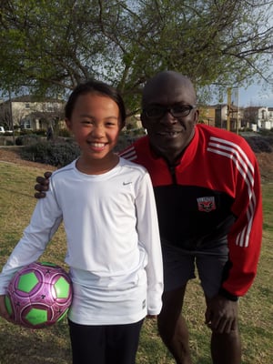 Conteh Soccer Academy student with Abdul T Conteh.