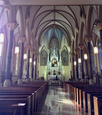 marble columns between the pews