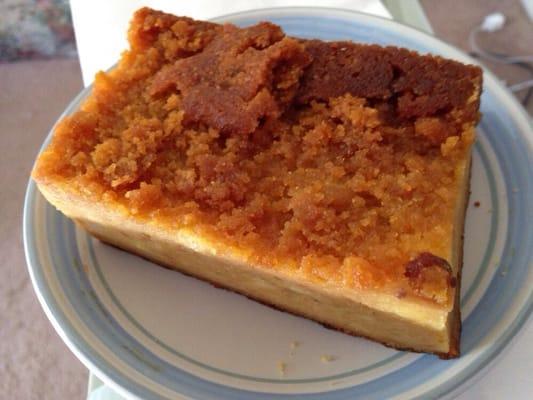 Slice of warm bread pudding. It's the size of a teacup saucer and it's just $1.00.