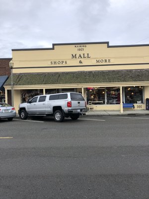 Front of building where the salon is at the end of hallway to left side.