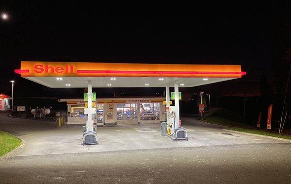 Photo of the forecourt and building during nighttime.