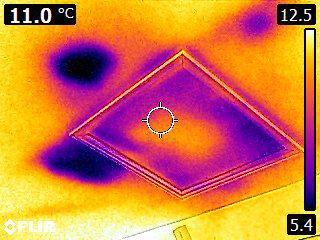 Insulation blown away around attic access