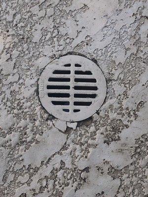 Crumbled Deck around the Drain Cover after the A&M guy tried to 'Puzzle Pieces" back in.