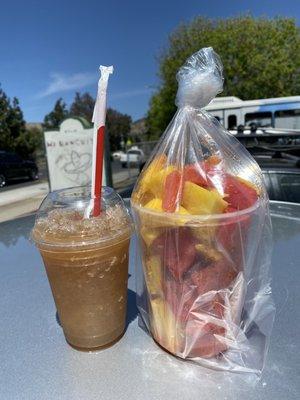 Close up of the tamarindo raspado and large fruit cup with mango and watermelon. $13