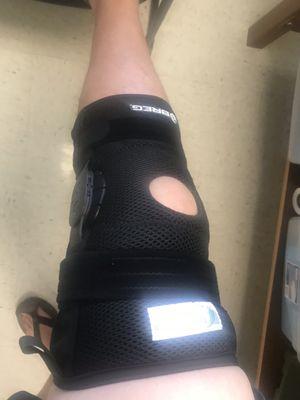 $1700 knee brace with office logo printed on it.